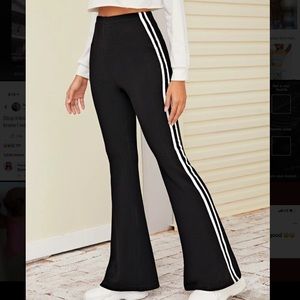 black striped stretchy pants .